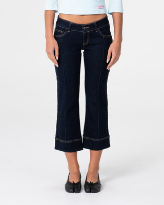 Woman wearing Muse Me Kick Capri Jean in Raw Dawg Blue