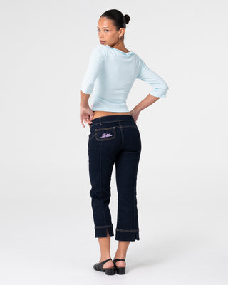 Woman wearing Muse Me Kick Capri Jean in Raw Dawg Blue