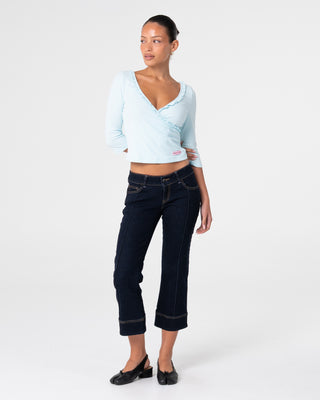 Woman wearing Muse Me Kick Capri Jean in Raw Dawg Blue