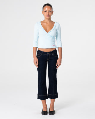 Woman wearing Muse Me Kick Capri Jean in Raw Dawg Blue