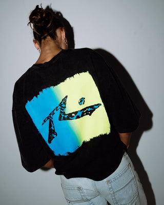 Man wearing Technicolour Tee in Washed Black