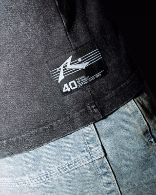 Man wearing Technicolour Tee in Washed Black