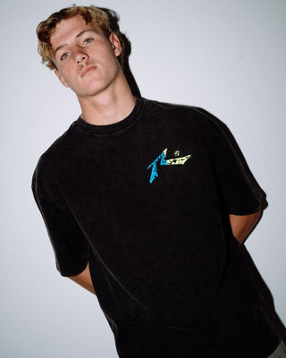 Man wearing Technicolour Tee in Washed Black