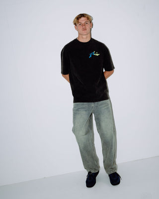 Man wearing Technicolour Tee in Washed Black
