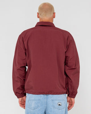 Man wearing Concealer Shell Jacket in Burgundy