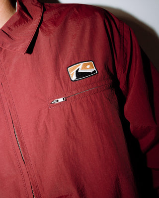 Man wearing Concealer Shell Jacket in Burgundy