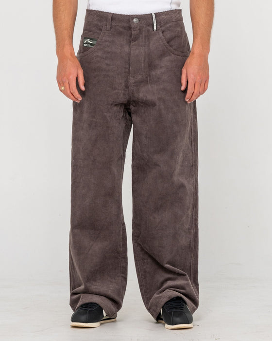 man-wearing-big-wale-corduroy-pant-in-dark-choc