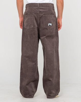 Man wearing Big Wale Corduroy Pant in Dark Choc