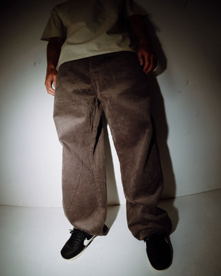 Man wearing Big Wale Corduroy Pant in Dark Choc