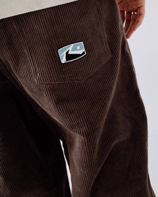 Man wearing Big Wale Corduroy Pant in Dark Choc