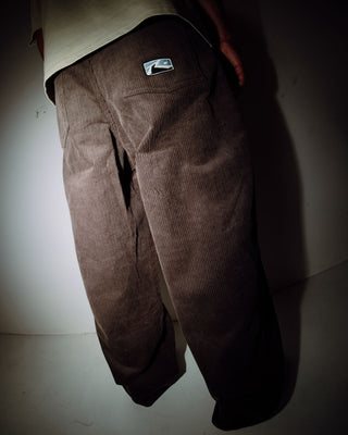 Man wearing Big Wale Corduroy Pant in Dark Choc