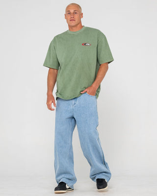 Man wearing Sleds N Threads Short Sleeve Tee in Oil Green