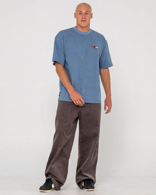 Man wearing Sleds N Threads Short Sleeve Tee in Real Teal