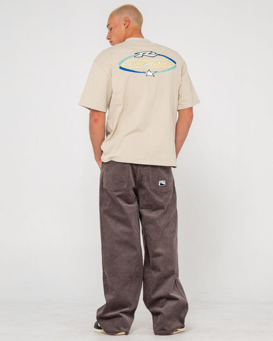 man-wearing-surfing-co-short-sleeve-tee-in-stone