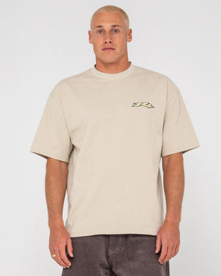 Man wearing Surfing Co Short Sleeve Tee in Stone