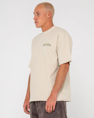 Man wearing Surfing Co Short Sleeve Tee in Stone