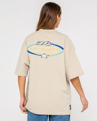 Man wearing Surfing Co Short Sleeve Tee in Stone