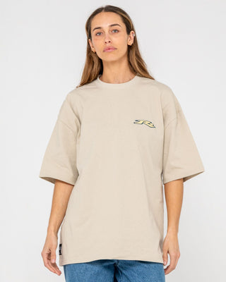 Man wearing Surfing Co Short Sleeve Tee in Stone