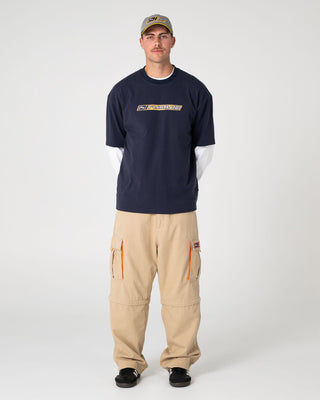 man-wearing-millennium-short-sleeve-tee-in-dark-blue