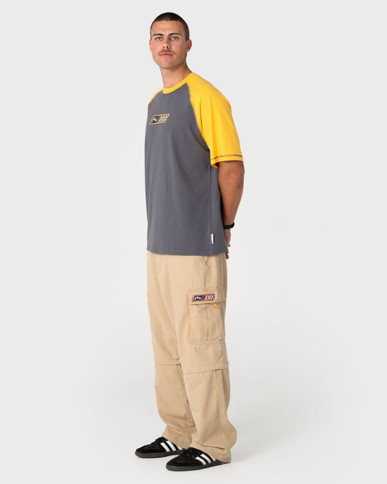 man-wearing-waka-raglan-short-sleeve-tee-in-steel