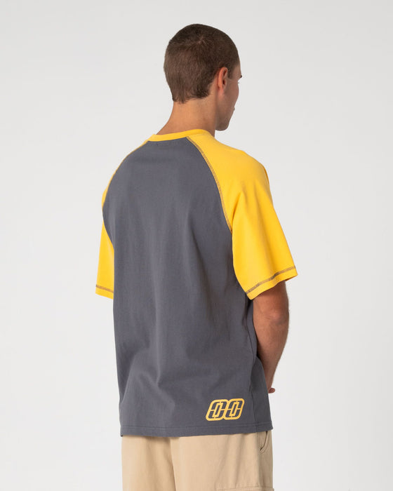 man-wearing-waka-raglan-short-sleeve-tee-in-steel