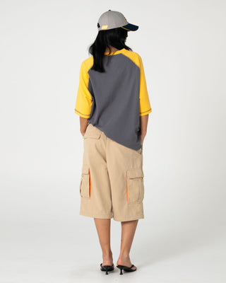 Man wearing Waka Raglan Short Sleeve Tee in Steel