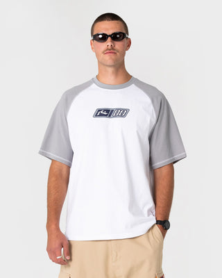 Man wearing Waka Raglan Short Sleeve Tee in White