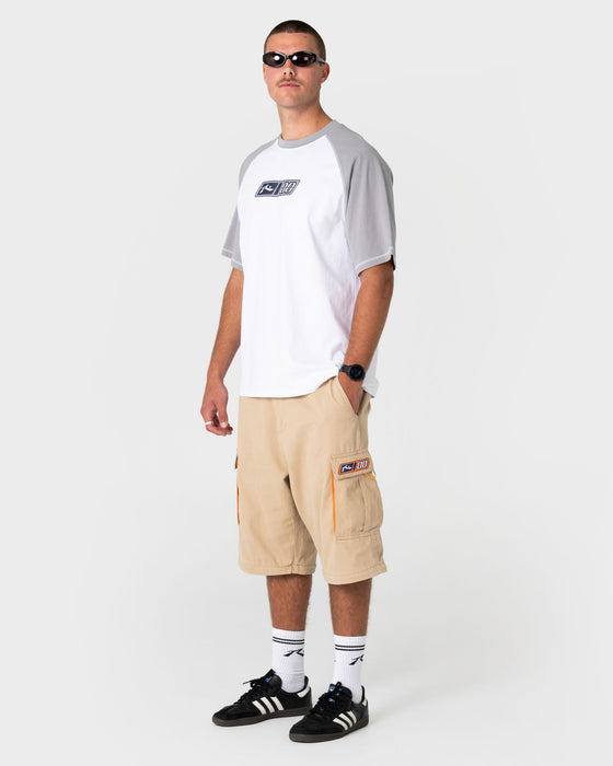 man-wearing-waka-raglan-short-sleeve-tee-in-white