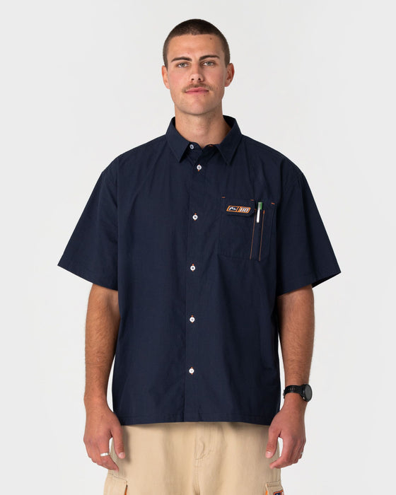 man-wearing-mosley-short-sleeve-shirt-in-navy-blue