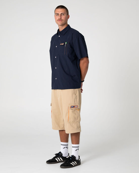 man-wearing-mosley-short-sleeve-shirt-in-navy-blue
