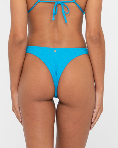 Woman wearing Sandalwood Brazilian Bikini Pant in Antarctic Blue