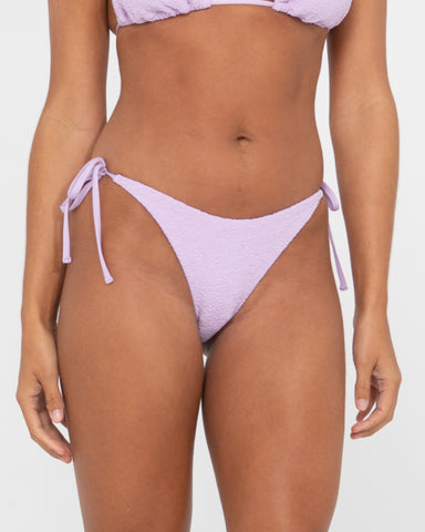 Woman wearing Sandalwood Midi Side Ties Bikini Pant in Muted Lavender