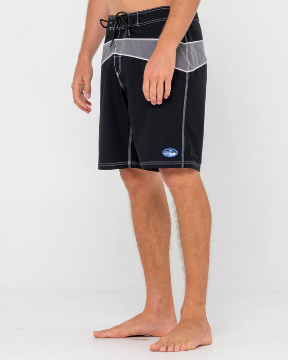 man-wearing-chop-suey-boardshort-in-black-grey
