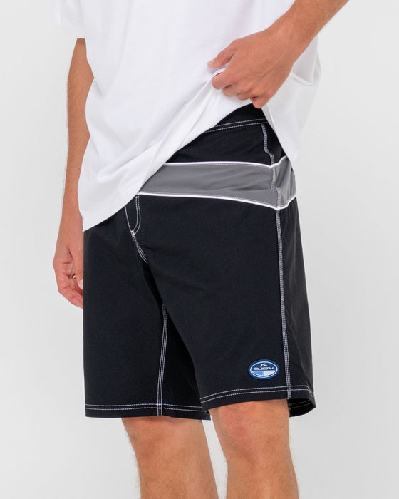 man-wearing-chop-suey-boardshort-in-black-grey