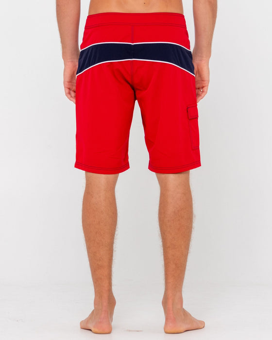man-wearing-chop-suey-boardshort-in-true-red