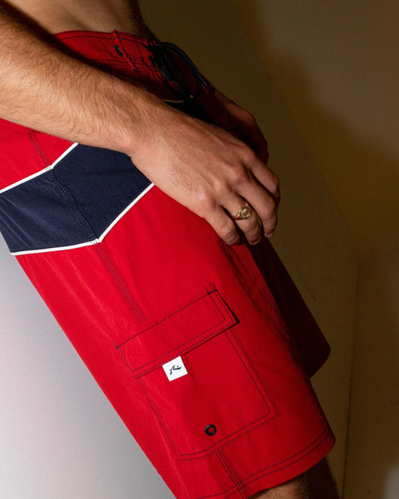 man-wearing-chop-suey-boardshort-in-true-red