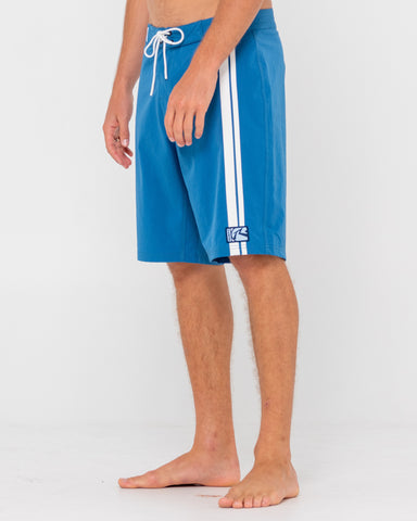 Man wearing Burnt Rubber Fitted Boardshort in Delft Blue