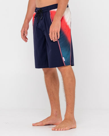 Man wearing V8 Printed Elastic Boardshort in Navy Blue