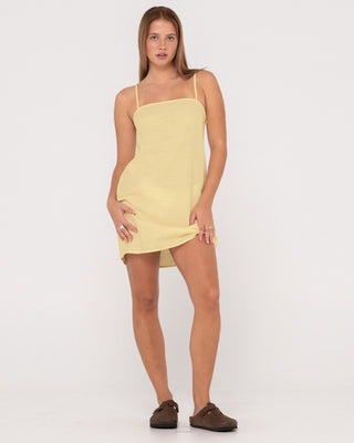 Woman wearing Sweet Water Mini Dress in Lemon Yellow