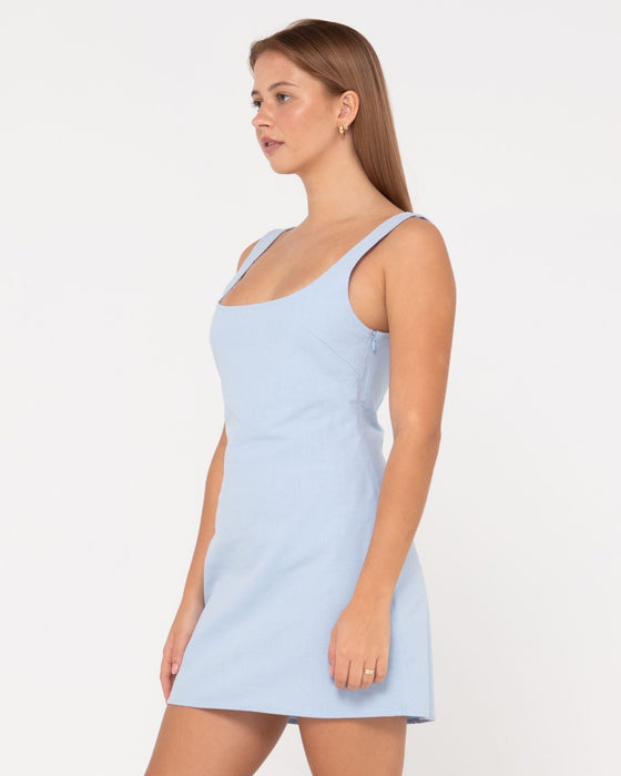 woman-wearing-meg-slip-dress-in-celestial-blue
