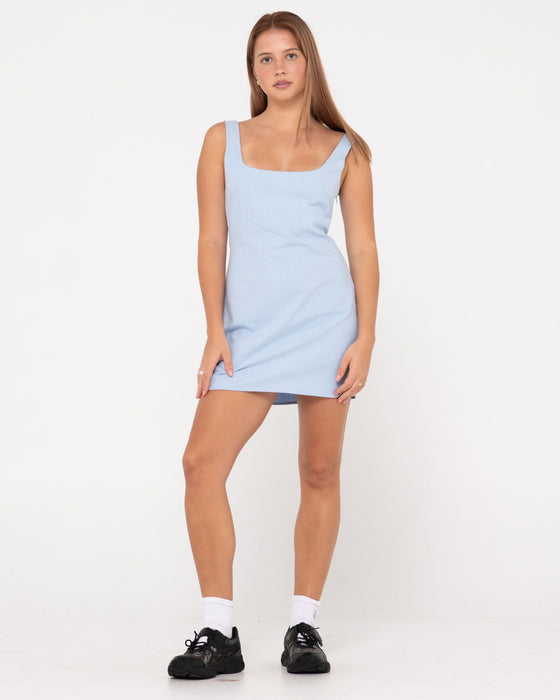 woman-wearing-meg-slip-dress-in-celestial-blue