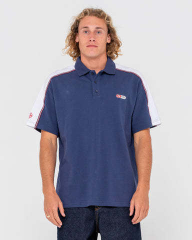 Man wearing Oxecutioner Short Sleeve Polo in Navy Blue