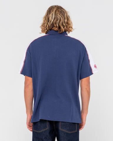 Man wearing Oxecutioner Short Sleeve Polo in Navy Blue