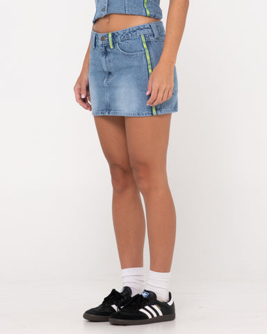 Woman wearing Flip Mommy Low Rise Mini Denim Skirt in Middy Blue / Lime