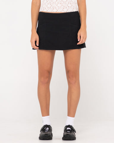 Woman wearing Percy Plaid Low Rise Mini Skirt in Black