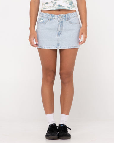 Woman wearing Mavericks Low Rise Denim Mini Skirt in Sky Blue Heather