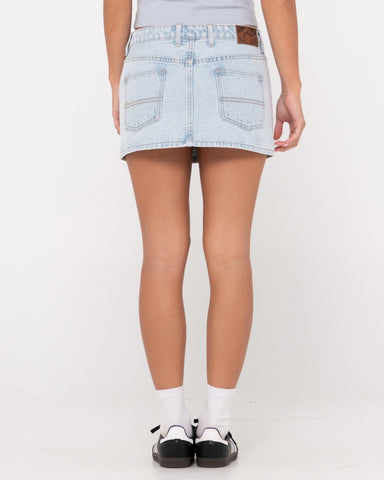 Woman wearing Mavericks Low Rise Denim Mini Skirt in Sky Blue Heather