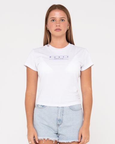 Woman wearing Rusty Essentials Skimmer Baby Tee in White