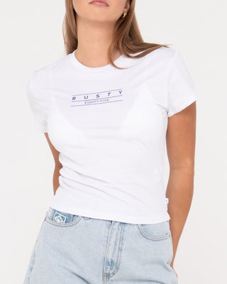 Woman wearing Rusty Essentials Skimmer Baby Tee in White