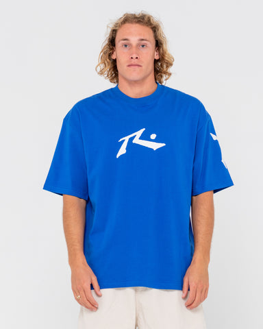 Man wearing Competition Revolution Short Sleeve Tee in Royal Blue